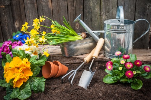 Volunteer charity group receiving reclaimed bricks and planters