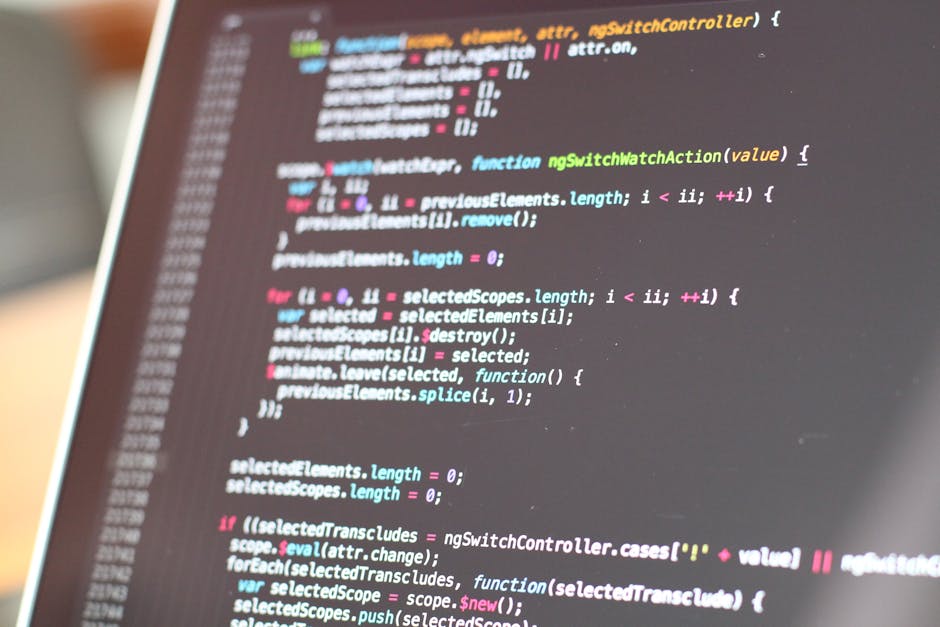A close-up view of a computer screen displaying lines of colorful programming code. The code features syntax highlighting with various colors such as blue, pink, green, and yellow, indicating differen